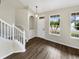 Bright foyer with hardwood floors and a staircase at 10472 Eastpark Lake Dr, Orlando, FL 32832