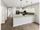 Open kitchen features a breakfast bar and modern cabinetry at 10472 Eastpark Lake Dr, Orlando, FL 32832