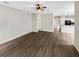 Large living room with hardwood floors and ceiling fan at 10472 Eastpark Lake Dr, Orlando, FL 32832