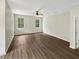 Spacious bedroom with wood-look floors and neutral walls at 10472 Eastpark Lake Dr, Orlando, FL 32832