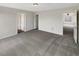Bright bedroom with grey carpet and access to other rooms at 10472 Eastpark Lake Dr, Orlando, FL 32832