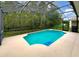 Screened-in pool with a large backyard at 10472 Eastpark Lake Dr, Orlando, FL 32832