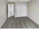 Bedroom featuring grey carpet and access to another room at 10472 Eastpark Lake Dr, Orlando, FL 32832
