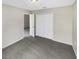 Bedroom with grey carpet and double door closet at 10472 Eastpark Lake Dr, Orlando, FL 32832