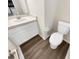 Clean bathroom with toilet and a white vanity at 10472 Eastpark Lake Dr, Orlando, FL 32832