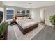 Large main bedroom with carpeted floor, large windows, and ensuite bathroom at 10472 Eastpark Lake Dr, Orlando, FL 32832