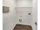 Convenient laundry room with shelving and hookups at 10472 Eastpark Lake Dr, Orlando, FL 32832