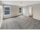 Spacious bedroom with grey carpet and large windows at 10472 Eastpark Lake Dr, Orlando, FL 32832