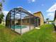Home with a screened in pool and backyard at 10472 Eastpark Lake Dr, Orlando, FL 32832