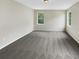 Spacious bedroom with neutral walls and grey carpet at 10472 Eastpark Lake Dr, Orlando, FL 32832