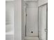 Bathroom featuring a shower with glass enclosure at 10472 Eastpark Lake Dr, Orlando, FL 32832