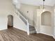 Elegant staircase with white railing in a spacious home at 10472 Eastpark Lake Dr, Orlando, FL 32832