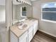 Bathroom boasts double sinks and a large vanity mirror at 10472 Eastpark Lake Dr, Orlando, FL 32832