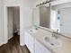 Double vanity bathroom with a soaking tub and separate toilet area at 10472 Eastpark Lake Dr, Orlando, FL 32832