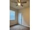 Bright bedroom with ceiling fan and window coverings at 3001 Greystone Loop # 101, Kissimmee, FL 34741