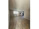 Open living room with tile flooring and kitchen view at 5505 Hernandes Dr # 238, Orlando, FL 32808