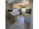 Galley kitchen with white cabinets and black appliances at 5505 Hernandes Dr # 238, Orlando, FL 32808