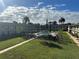 Community features a refreshing pool surrounded by lush landscaping at 5505 Hernandes Dr # 238, Orlando, FL 32808