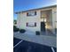 Exterior view of a condo building with stairs at 5505 Hernandes Dr # 238, Orlando, FL 32808