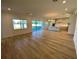 Open concept kitchen with light cabinets and hardwood floors at 58 Overleaf Ln, Orlando, FL 32839