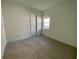 Simple bedroom with neutral walls and carpeting at 58 Overleaf Ln, Orlando, FL 32839