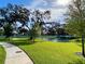 Community features a pond, walking path, and lush green spaces at 58 Overleaf Ln, Orlando, FL 32839