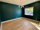Elegant dining room with teal walls and hardwood floors at 58 Overleaf Ln, Orlando, FL 32839