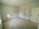 Bright bedroom with neutral wall paint and carpet at 58 Overleaf Ln, Orlando, FL 32839