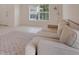 Living room featuring a beige sofa and large window at 3458 Bonnet Creek Pl, Kissimmee, FL 34746