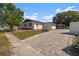 Front exterior view of the home with paved driveway at 2259 Howland Blvd, Deltona, FL 32738