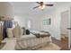 Main bedroom with a king-size bed, ceiling fan, and ensuite bathroom at 2259 Howland Blvd, Deltona, FL 32738