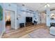 Living room with hardwood floors and a view of kitchen at 21908 Royal St Georges Ln, Leesburg, FL 34748