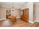 Dining room with wood floors, table, and hutch at 1716 Harris Hawk Rd, Orlando, FL 32837