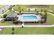 Community pool with cabana and surrounding landscaping at 6118 Galloping Dr, Apopka, FL 32712