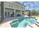 Inviting kidney-shaped pool with a screened enclosure at 15543 Pebble Ridge St, Winter Garden, FL 34787
