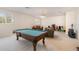 Game room with pool table, sofas, and plenty of space at 15543 Pebble Ridge St, Winter Garden, FL 34787