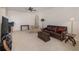 Cozy living room with a leather couch and a large TV at 15543 Pebble Ridge St, Winter Garden, FL 34787