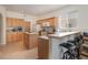 Kitchen with light wood cabinets and an island at 15543 Pebble Ridge St, Winter Garden, FL 34787