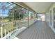 Covered balcony overlooking the pool and golf course at 15543 Pebble Ridge St, Winter Garden, FL 34787