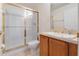 Clean bathroom with shower and tub, wood vanity at 15543 Pebble Ridge St, Winter Garden, FL 34787