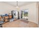 Kitchen features stainless steel refrigerator and access to backyard patio at 15543 Pebble Ridge St, Winter Garden, FL 34787