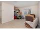 Bonus room with french doors and two wicker chairs at 15543 Pebble Ridge St, Winter Garden, FL 34787