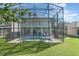 Two-story house with pool and screened enclosure at 15543 Pebble Ridge St, Winter Garden, FL 34787
