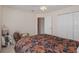 Spacious bedroom with double doors leading to a hallway at 15543 Pebble Ridge St, Winter Garden, FL 34787