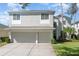 Two-story house with two-car garage and landscaping at 15543 Pebble Ridge St, Winter Garden, FL 34787
