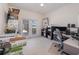 Home office with built-in shelving and backyard access at 15543 Pebble Ridge St, Winter Garden, FL 34787