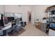 Home office with desk, computer, and ample storage at 15543 Pebble Ridge St, Winter Garden, FL 34787