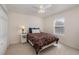 Small bedroom with a twin bed, carpet, and window at 15543 Pebble Ridge St, Winter Garden, FL 34787