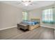 Spacious bedroom with hardwood floors and a light and airy feel at 500 Teacup Springs Ct, Winter Garden, FL 34787