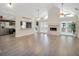 Open living room with kitchen and fireplace at 500 Teacup Springs Ct, Winter Garden, FL 34787